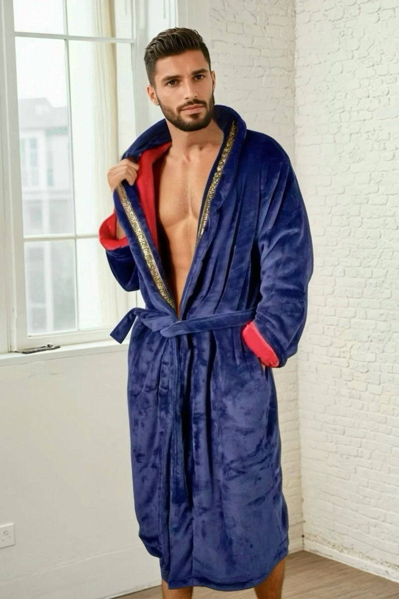 Male model wearing the blue Royal King Robe by Royalty Robes. Double layer robe with blue exterior and red interior and gold Greek key trim. Soft fleece mens robe with pockets. Luxury housecoat for men.