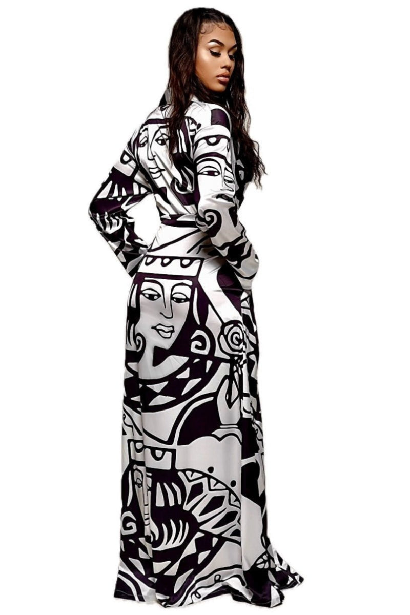 Model wearing a long flowing black and white abstract print duster style wrap dress, womens robe - housecoat for women. The back side of a black and white long dress.