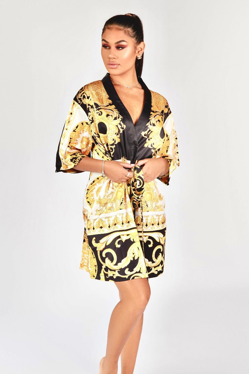 Model wearing a black, yellow and white short kimono style Barocco print luxury robe