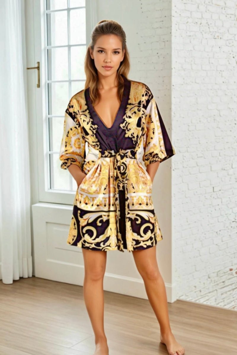 Model wearing a black, yellow and white short kimono style Barocco print luxury robe
