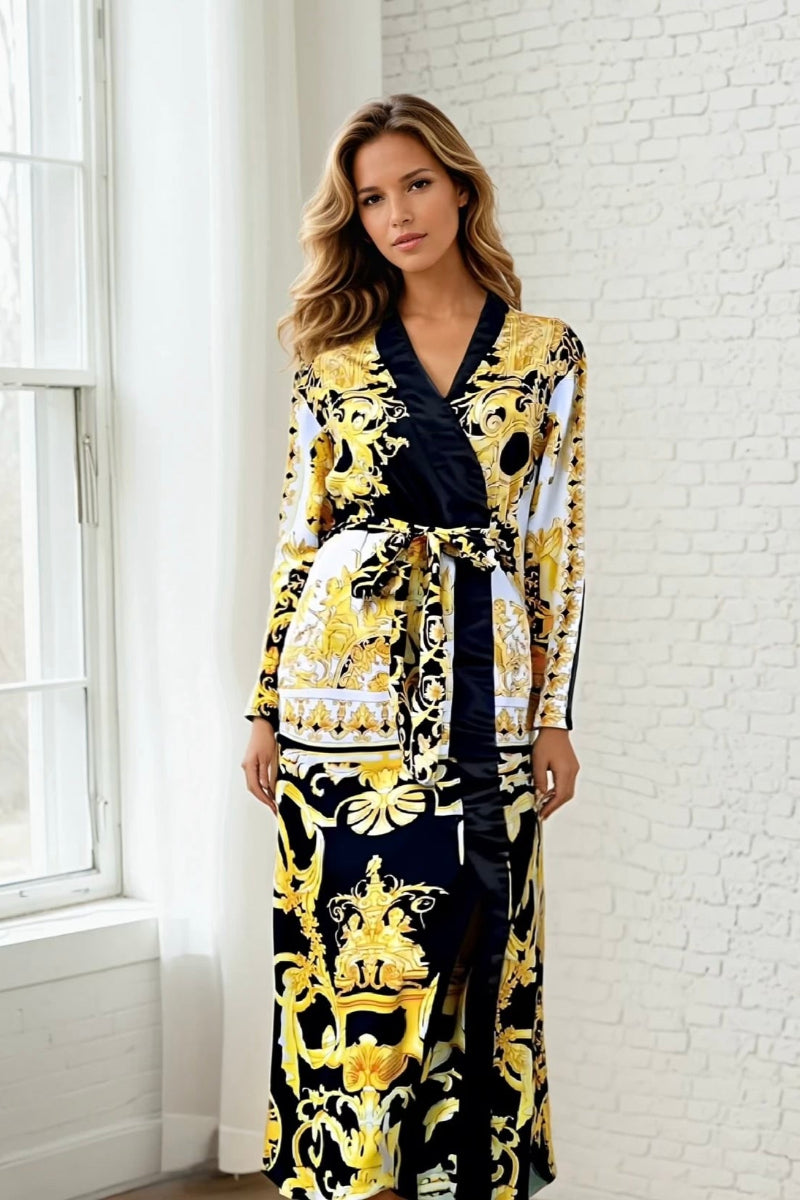 Model wearing a long black, yellow and white Barocco style robe with long sleeves. Floor length wrap duster dress for women.