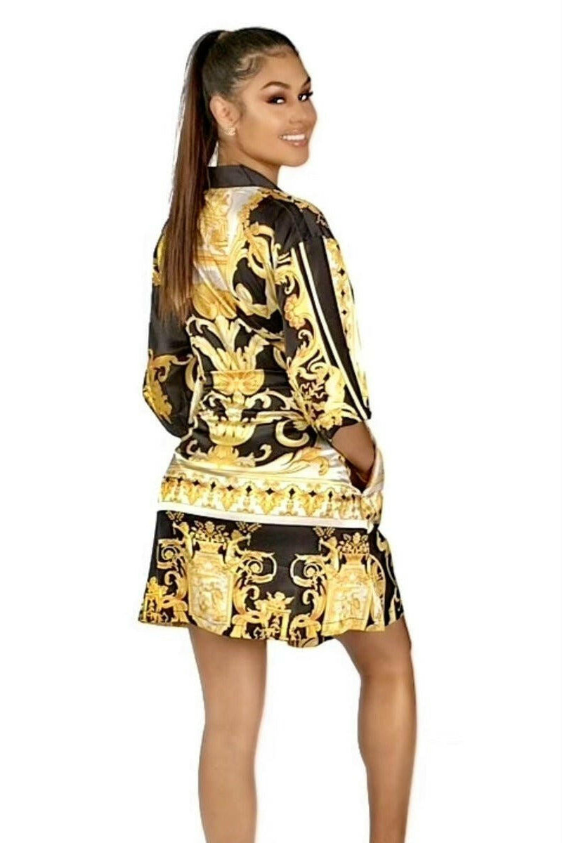 Model wearing a black, yellow and white short kimono style Barocco print luxury robe