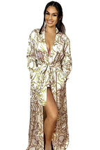 Model wearing a  long, white and gold abstract duster for women, Barocco print floor length women's silky wrap dress. Luxury designer women's casual sleep and loungewear with a gold chain design.
