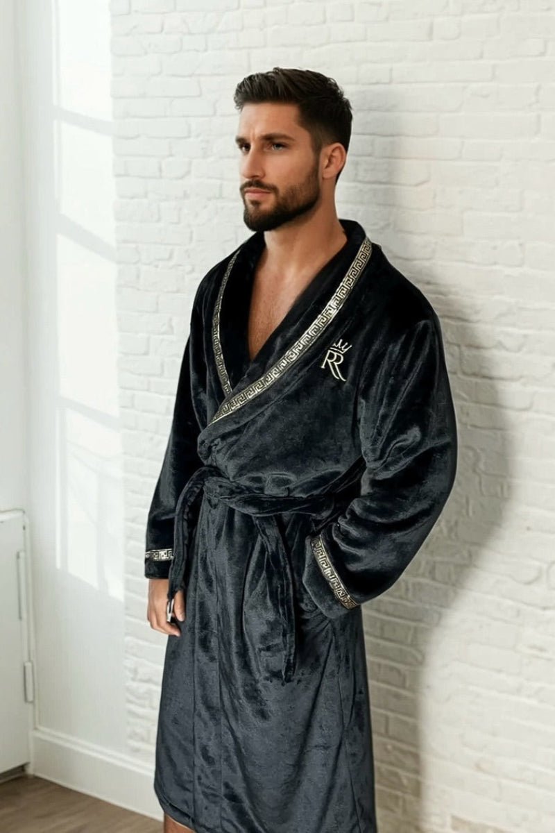 Black Royalty Robe - Royalty Robes - male male model wearing a black bathrobe with gold Greek key trim and pockets. Soft fleece mens robe.
