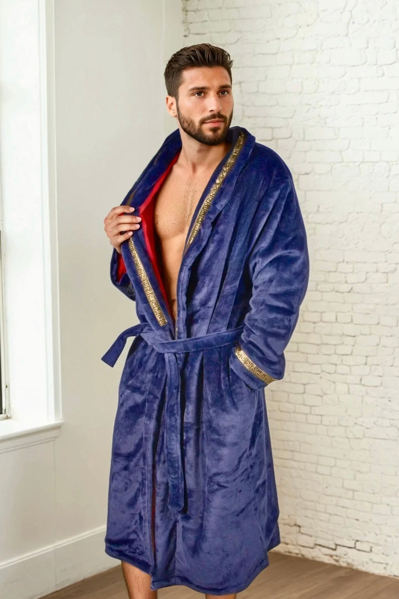 Male model wearing the blue Royal King Robe by Royalty Robes. Double layer robe with blue exterior and red interior and gold Greek key trim. Soft fleece mens robe with pockets. Luxury housecoat for men.