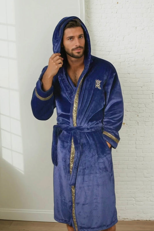 Man wearing the blue hooded Royalty Robe with gold Greek key trim and pockets. Soft fleece bathrobe with hood