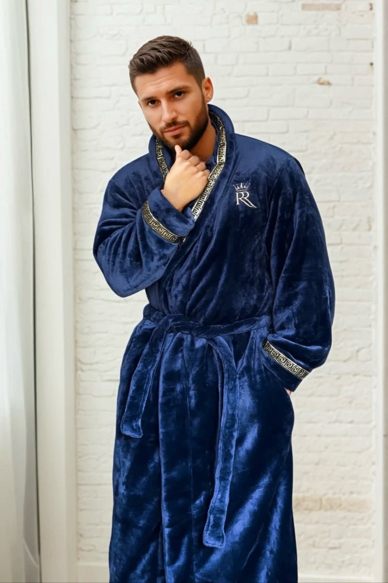 Male model wearing a blue robe. Dark blue, soft and cozy fleece mens bathrobe, housecoat loungewear with gold Greek key trim. Great gift for men. 