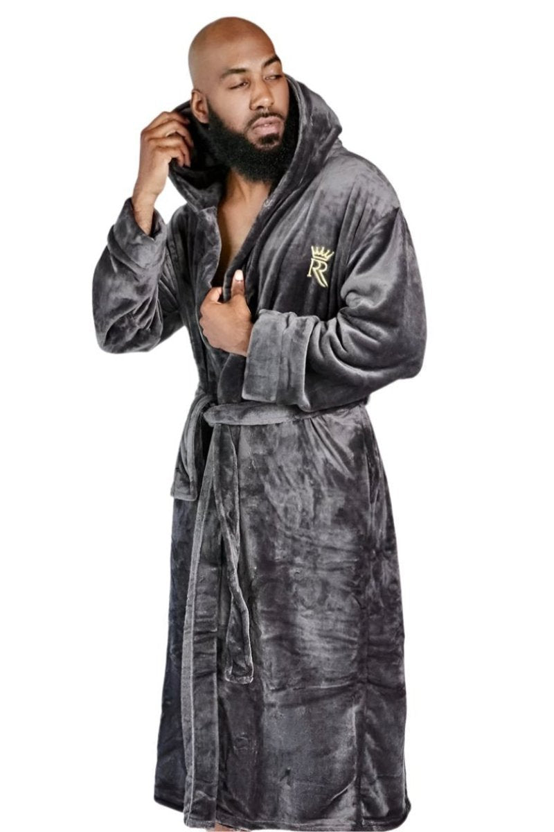 Male model wearing a soft fleece, grey bathrobe with hood. 
