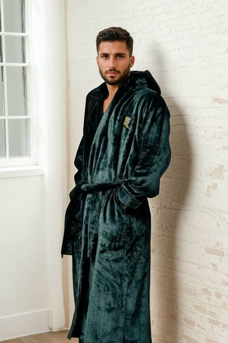 Male model wearing a long, dark green, soft bathrobe with hood. 