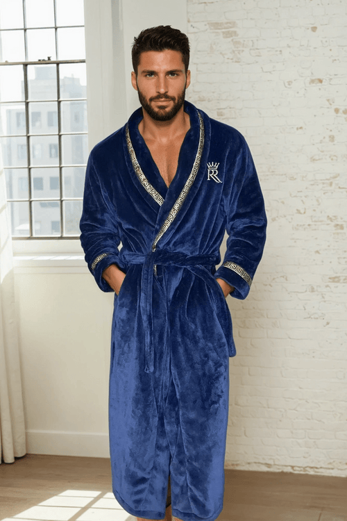 Male model wearing a blue robe. Dark blue, soft and cozy fleece mens bathrobe, housecoat loungewear with gold Greek key trim. Great gift for men. 