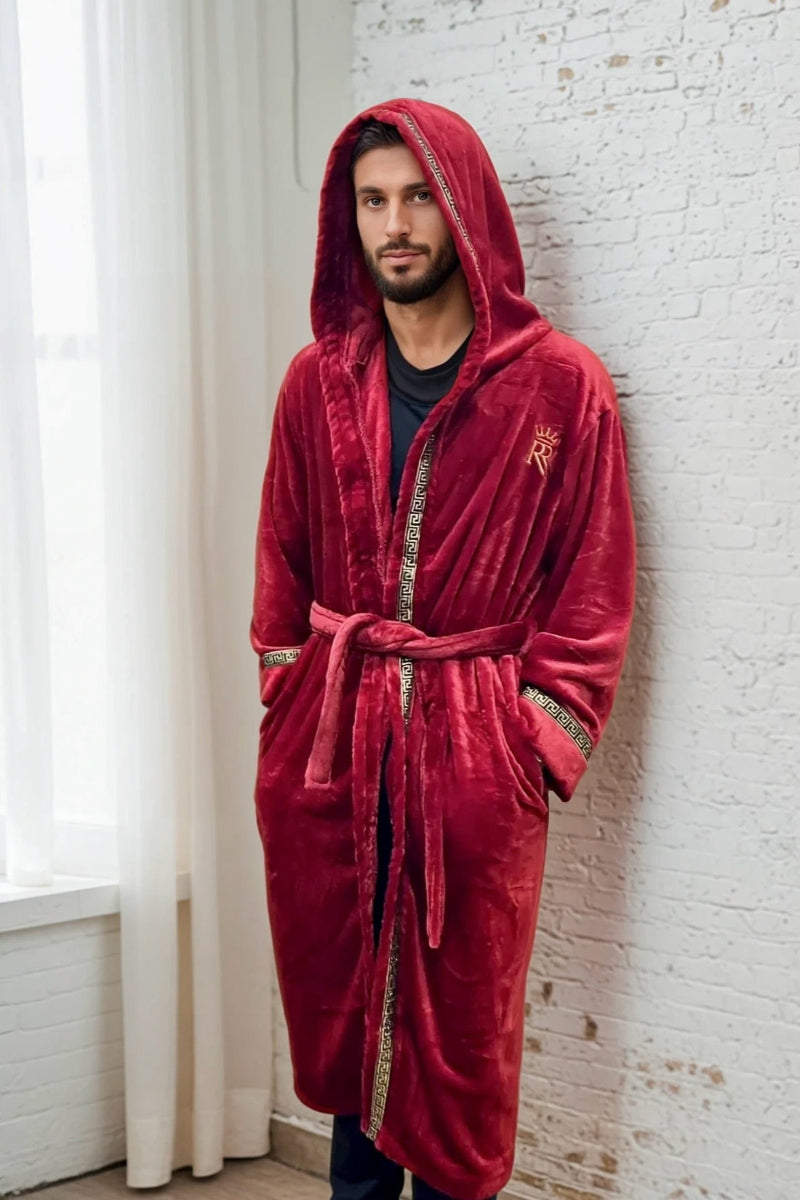 Man wearing the burgundy hooded Royalty Robe with gold Greek key trim and pockets. Soft fleece bathrobe with hood.
