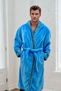 Sky Blue Royalty Robe - Royalty Robes - male model wearing a soft blue, long bathrobe with hood and gold Greek key trim and pockets.