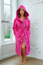 Pink Hooded Royalty Robe - Royalty Robes - model wearing a bright pink fuchsia bathrobe with gold Greek key trim and pockets.