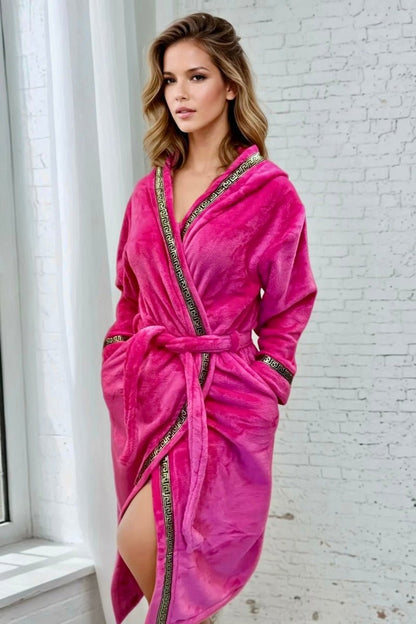 Pink Hooded Royalty Robe - Royalty Robes - model wearing a bright pink fuchsia bathrobe with gold Greek key trim and pockets.