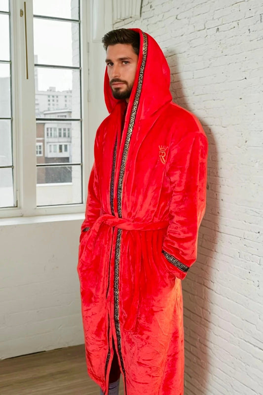 Man wearing the red hooded Royalty Robe with gold Greek key trim and pockets. Soft fleece bathrobe with hood.