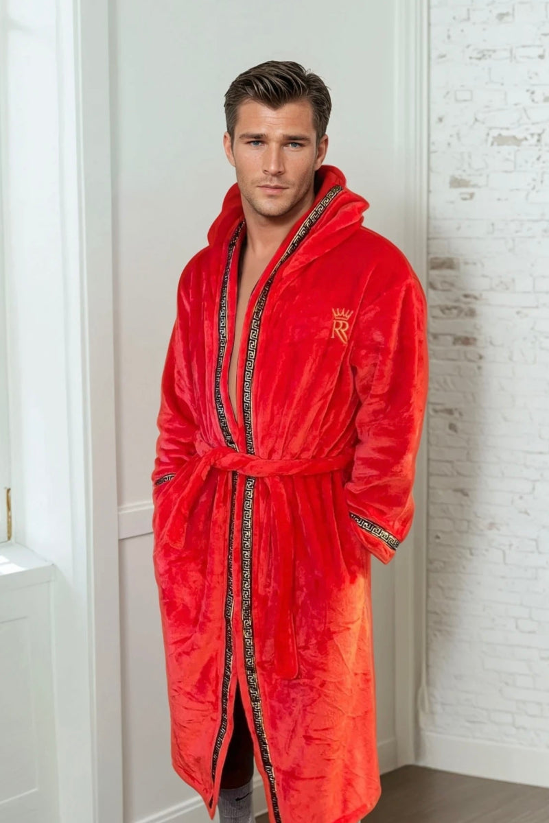 Man wearing the red hooded Royalty Robe with gold Greek key trim and pockets. Soft fleece bathrobe with hood.