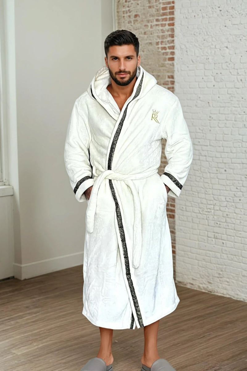 Man wearing the white hooded Royalty Robe with gold Greek key trim and pockets. Soft fleece bathrobe with hood for men.