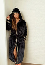 Woman modeling Royalty Robes black hooded robe with gold Greek key trim.