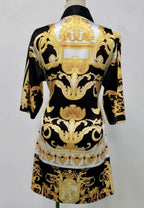 The back side of a black, yellow and white short kimono style Barocco print luxury robe 