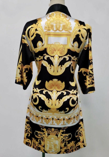 The back side of a black, yellow and white short kimono style Barocco print luxury robe 