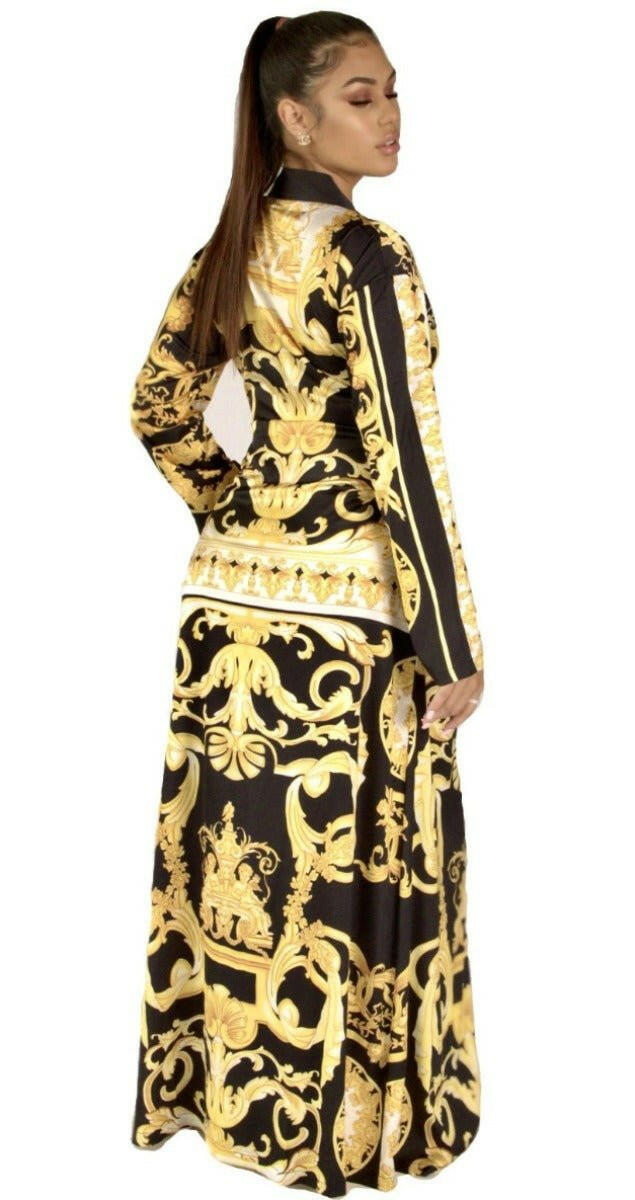 Model wearing a yellow, black and white long and flowing duster style wrap dress robe housecoat with barocco print